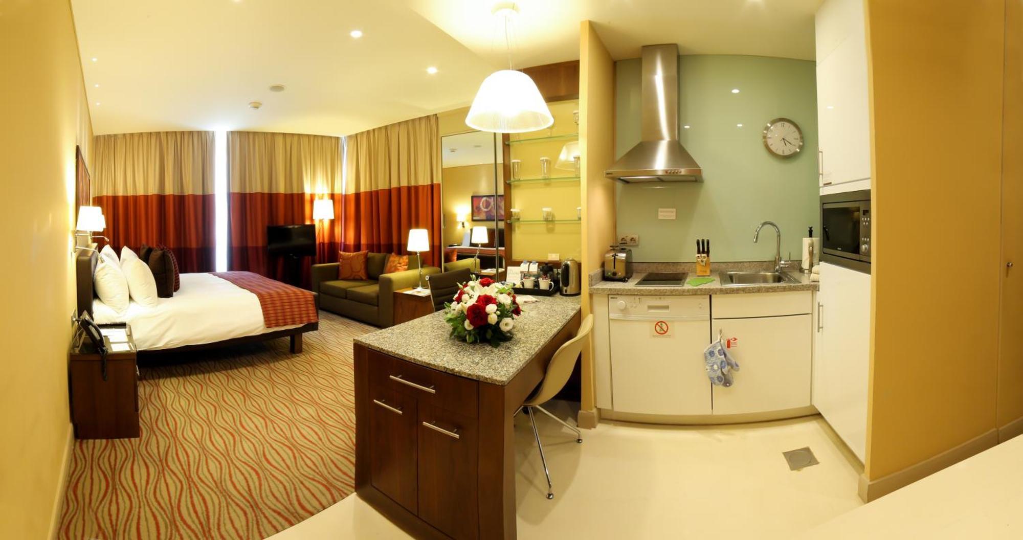 King Studio Suite with Balcony and City View - Non-Smoking