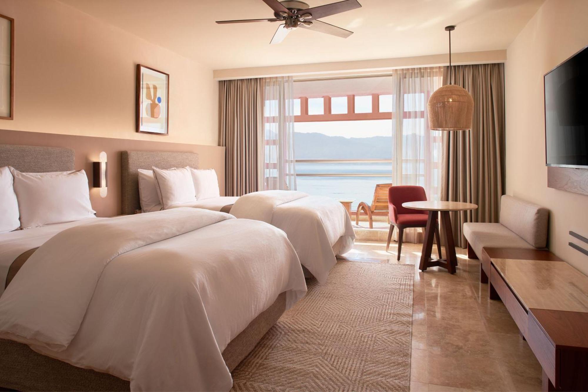 Junior Suite with Two Double Beds and Partial Ocean View,1563278125:JPEG