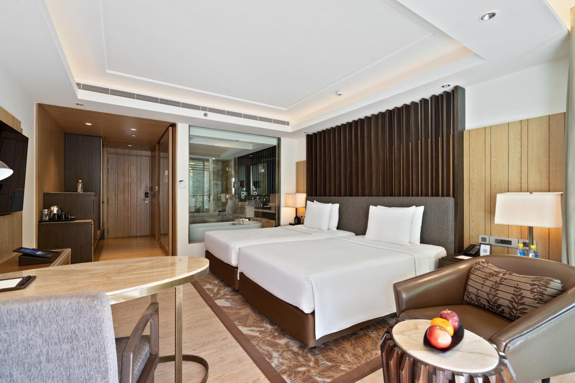 Deluxe Twin Balcony Room Bathtub Enjoy INR 1000 Signature Resort Credit per