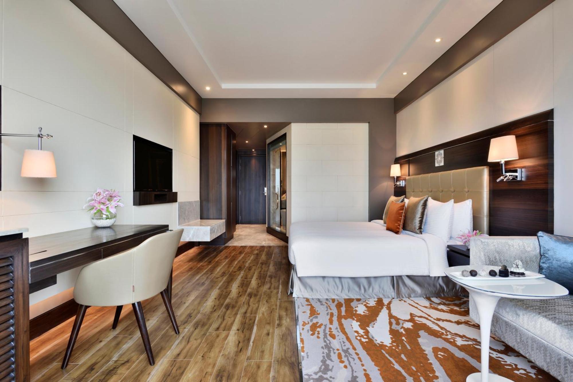 Deluxe King Room Bed with 15% discount on food, beverages, laundry and spa