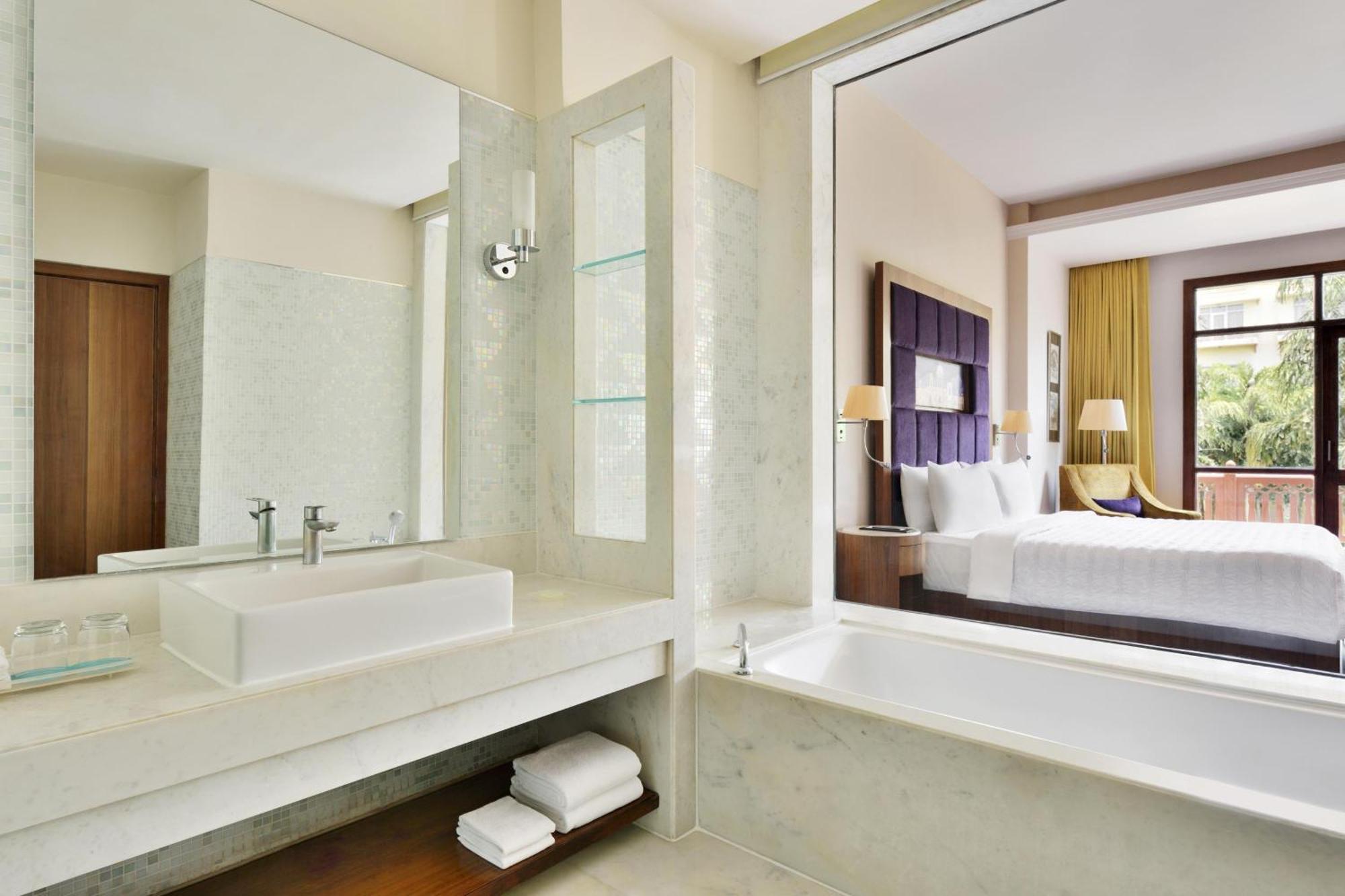 Deluxe Double Room with Garden View( 20% discount on food and soft beverages, 20% discount on Spa,Buy 1 get 1 on select brands at Madeira bar between 4 pm - 10 pm)eira bar between 4 pm - 10 pm)