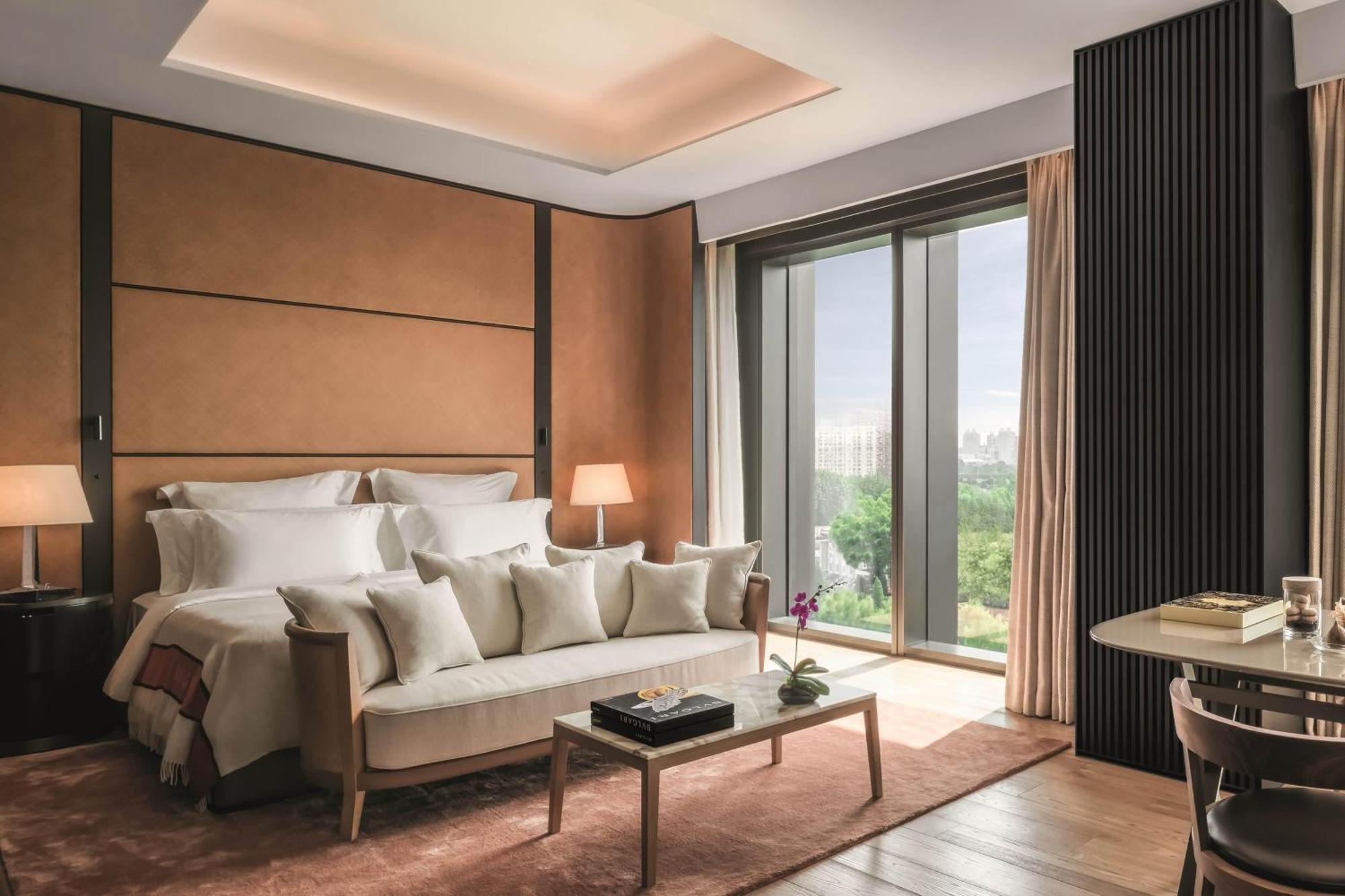 Premium Room One King Bed Liangma River View Minibar soft drinks & beers 3km pick-up or drop-off service Berluti shoe shinning & pressing service