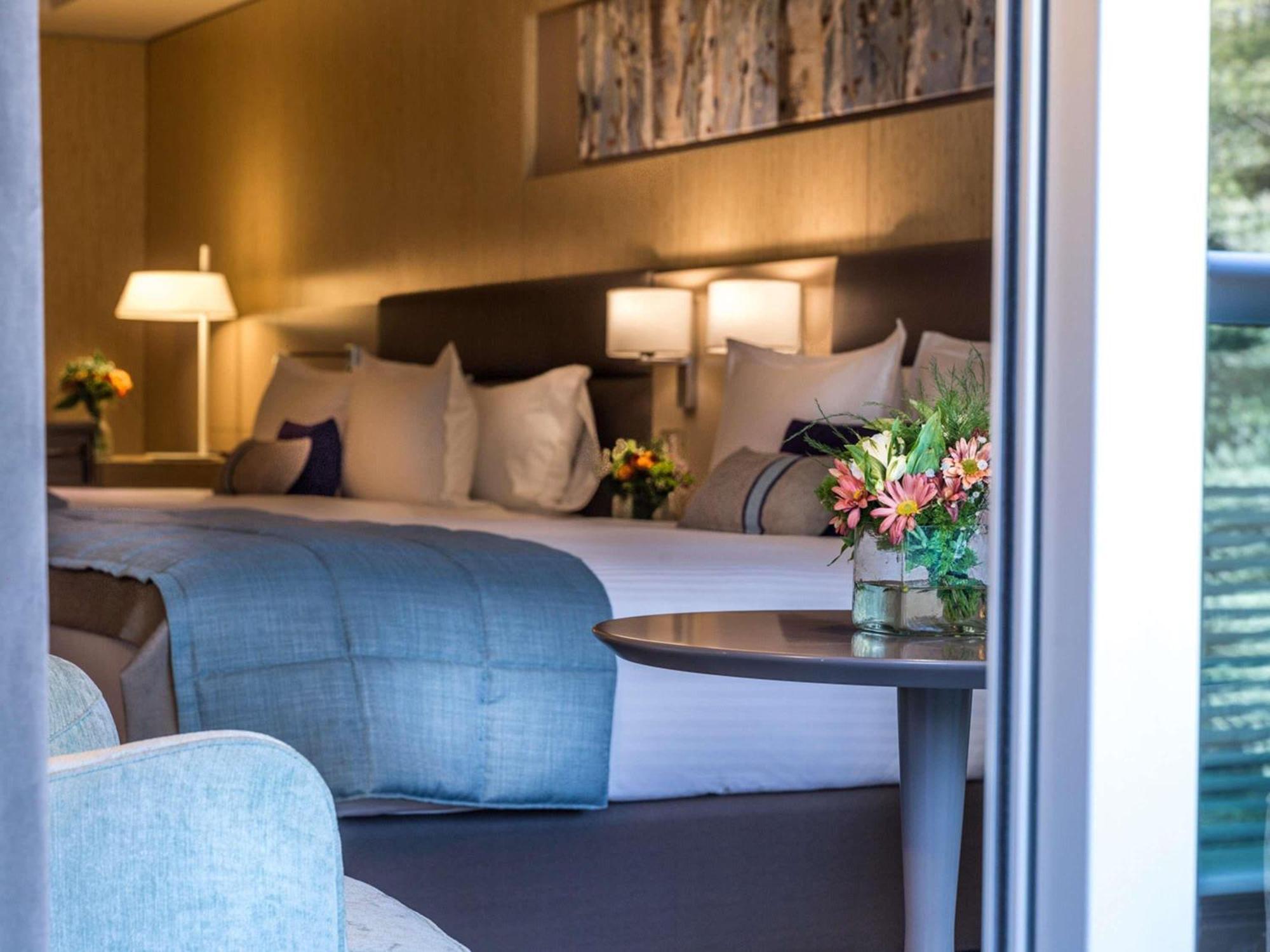 Deluxe Suite with Two Double Beds, Balcony and Park View