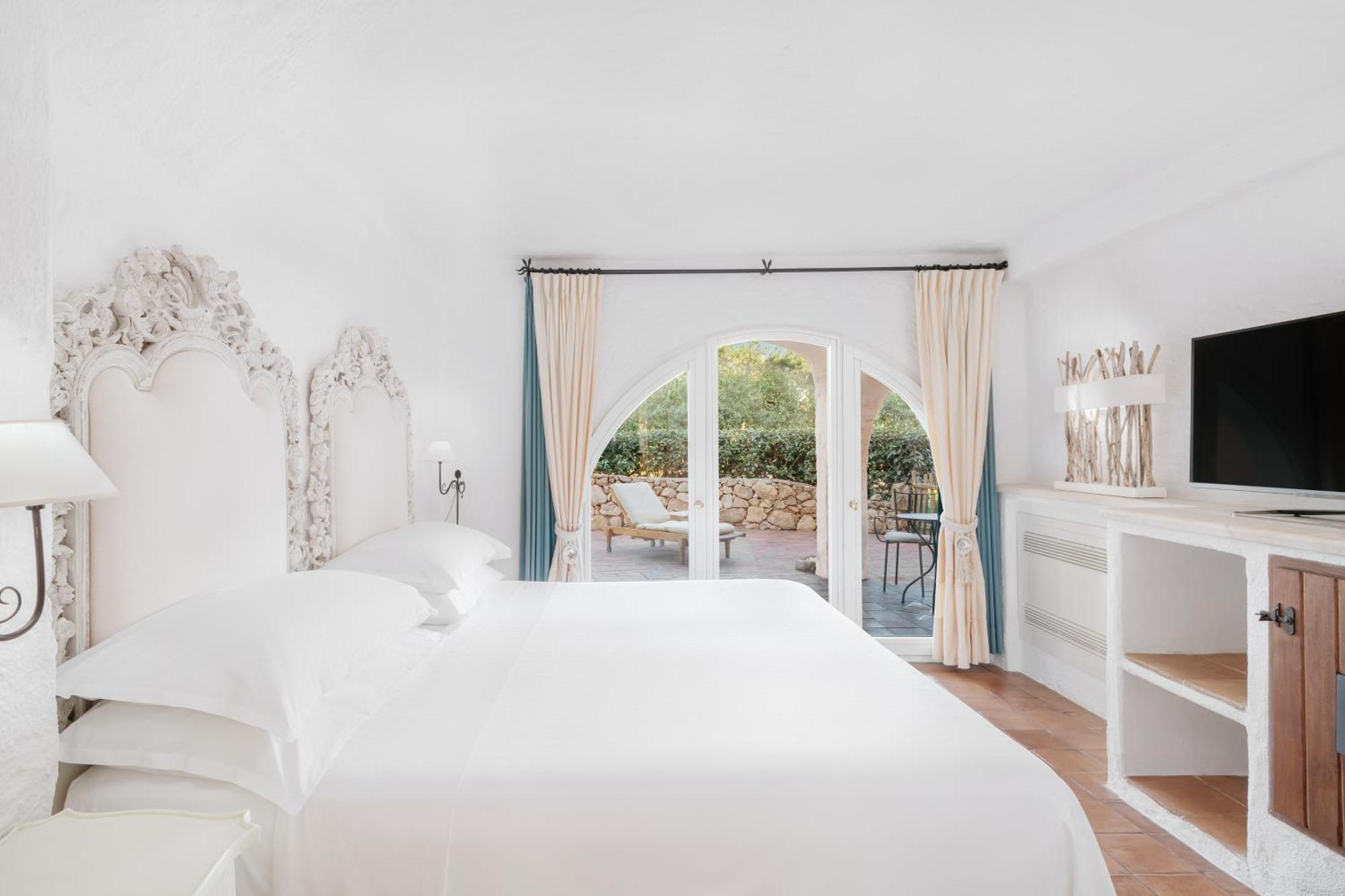 Two-bedroom Deluxe Suite King size bed pool or canal view terrace