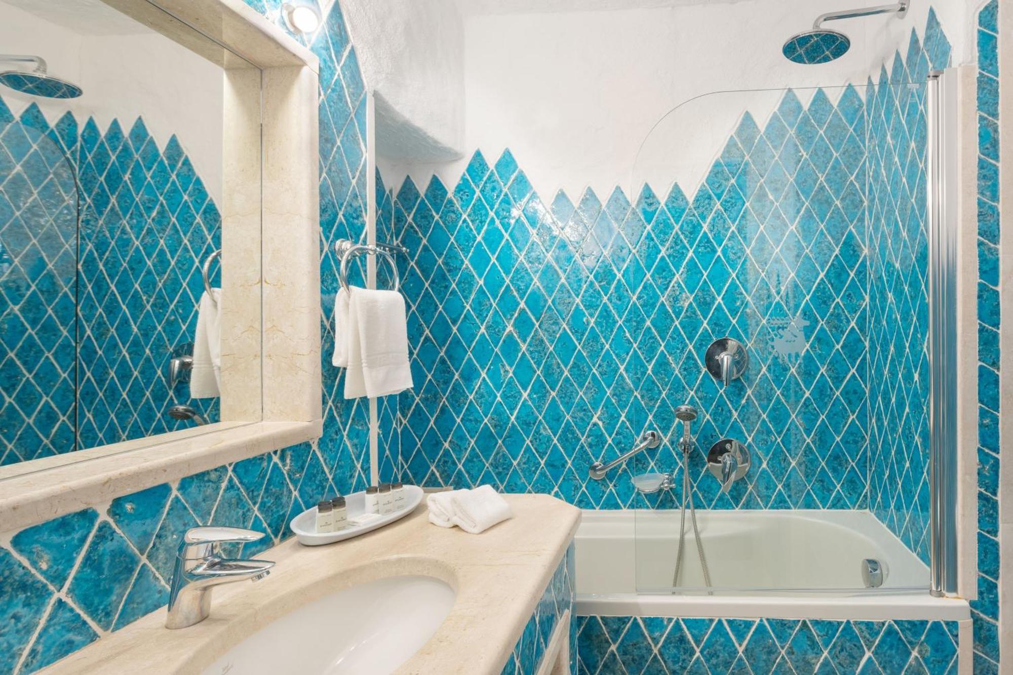 Two-bedroom Deluxe Suite King size bed pool or canal view terrace