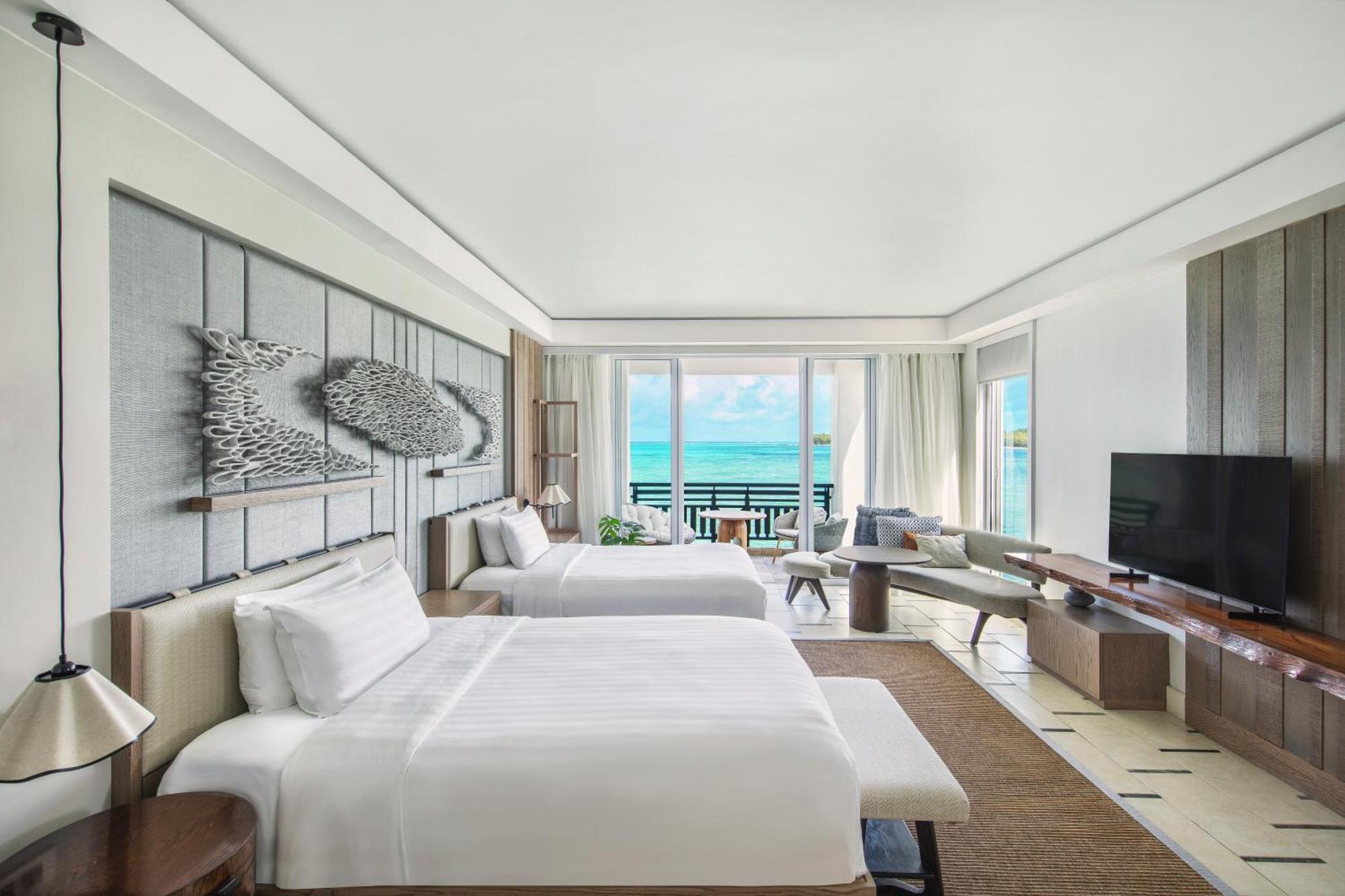 Junior Suite Frangipani mit Zweibettzimmer und Meerblick
