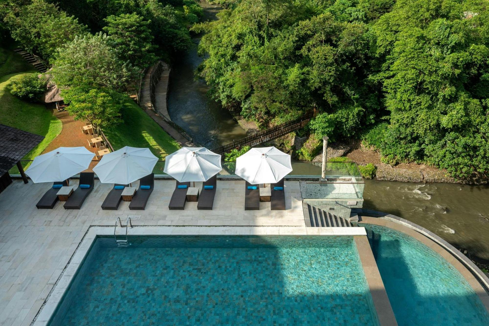 Deluxe Twin Balcony Room River View daily shuttle to Ubud City Photo Session Art Gallery Visit 24-hour access to Fitness Center Welcome Drink Kids Activities,1774532200:JPEG